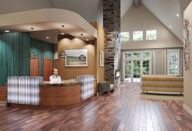 View of the front lobby and concierge desk at a senior living community