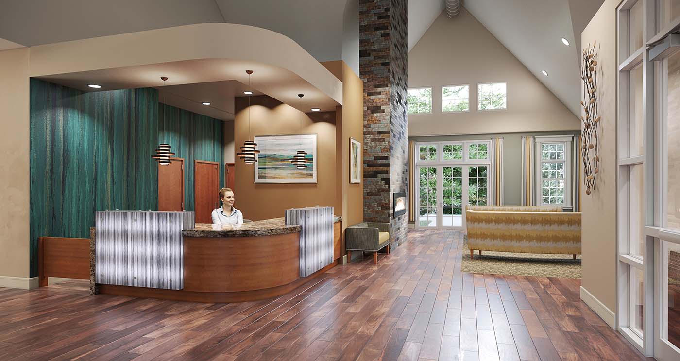 View of the front lobby and concierge desk at a senior living community