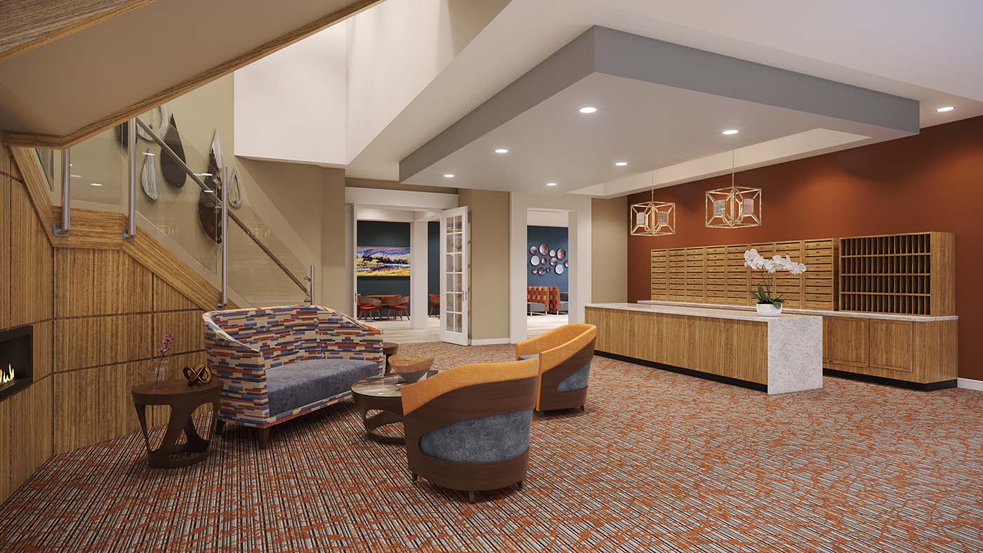 View of an indoor sitting area with a couch, two chairs, and a long counter