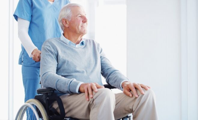 Shot of a senior man in a wheelchair being cared for by a nurse