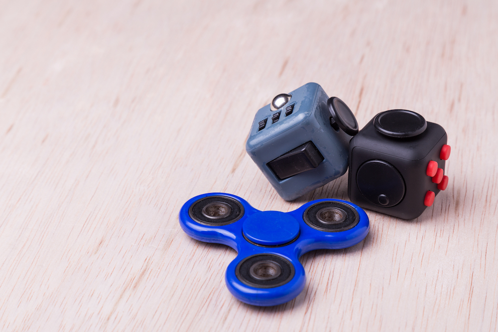 Fidget spinner and fidget cubes. Research suggests that intentional fidgeting may be a useful coping mechanism for anxiety and offer other health benefits as well.