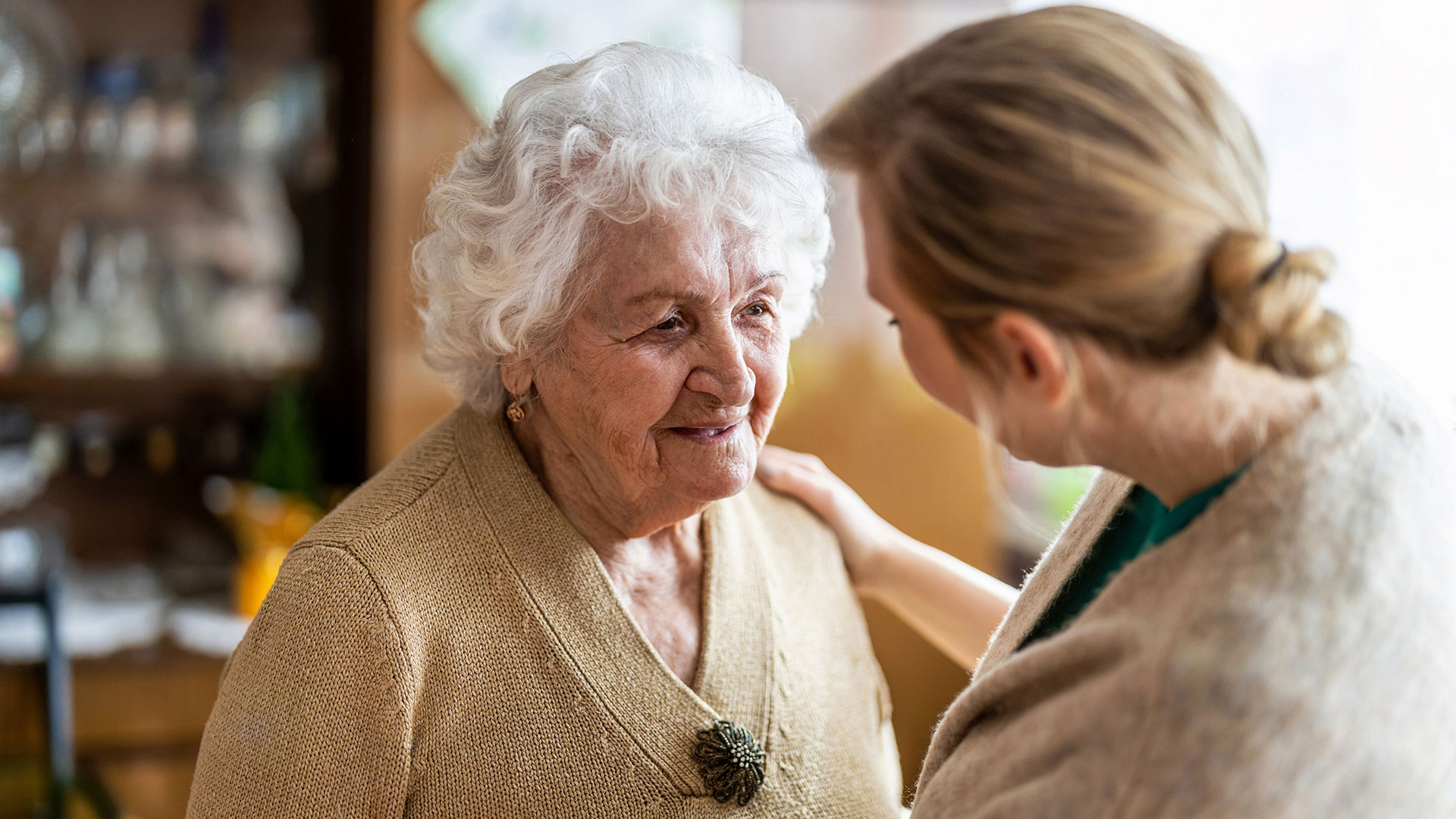 Senior woman speaking with her adult daughter